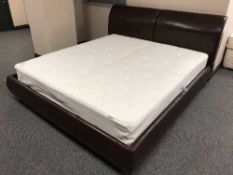 A 6' brown leather bed frame and an Ikea Sultan mattress