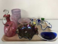 A tray of cranberry glass decanter with stopper, carnival glass, assorted glass vases, bowls,