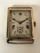 A vintage oblong gold watch,