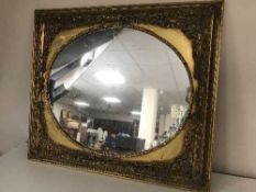 A decorative gilt framed mirror