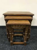 A nest of three oak tables