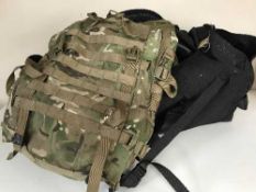 A large holdall of DP rucksack, clothing, boots,