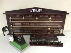 A Riley snooker score board with cue stand and Riley snooker table cloth iron