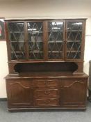 A mahogany bookcase fitted cupboards and drawers below