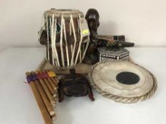 A tray of tribal drum, tribal figures, Peruvian pipes,