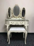A cream and gilt dressing table with mirror and stool
