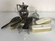 A silver and tortoiseshell part dressing table set, together with two other brushes,