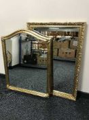 A gilt framed arched topped mirror and one other