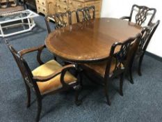A reproduction dining table plus leaf and six Hepplewhite style chairs