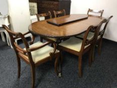 A twin pedestal dining table with leaf and six chairs