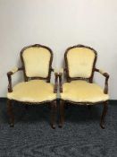 A pair of salon armchairs in gold dralon