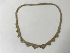 A 9ct gold articulated necklace, 23.