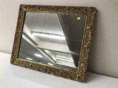 An antique gilt framed mirror