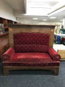 A late 19th century inlaid mahogany scroll arm settee