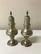 A pair of silver sifters, 6.