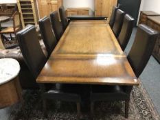 A Chapmans high quality carved oak refectory style table, fully extended 273.