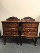 A pair of continental style bedside chests