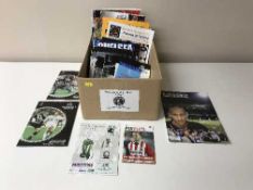 A box containing a quantity of miscellaneous football programmes,