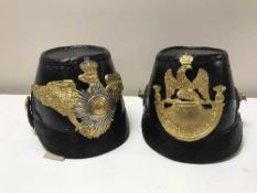 Two leather metal mounted Prussian helmets