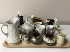 A tray containing a large quantity of late 19th/20th century pottery and china jugs,