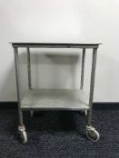 A stainless steel two tier medical trolley