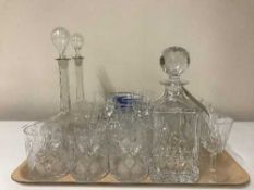A tray of assorted lead crystal, decanters,