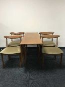 A late 20th century teak G Plan drop leaf table and four chairs