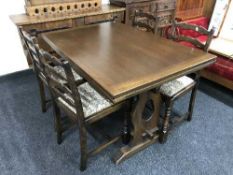 An oak refectory table and four ladder back chairs