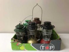 A box of four paraffin lamps, paraffin stove,