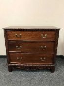 A Georgian style three drawer chest