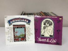 A box containing a large quantity of LP's - John Williams Music of the World etc