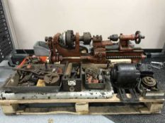 A vintage lathe on metal stand,