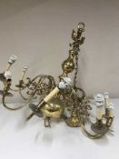 An impressive brass ten branch chandelier