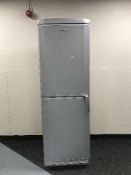 A silver Servis upright fridge freezer
