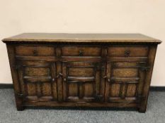 A Georgian style oak low dresser