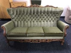 A three piece wood framed lounge suite