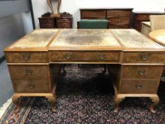 A good quality walnut desk with brown tooled leather top