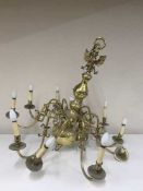 An impressive brass ten branch chandelier