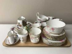 A tray containing a part Phoenix china and Queen Anne china tea service, Staffordshire milk jug,