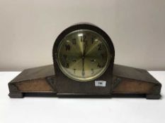 An oak and walnut cased mantel clock