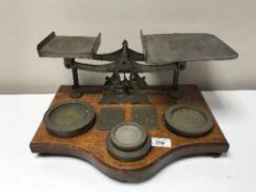 A set of antique postal scales with weights