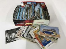 A tin of 20th century colour British postcards