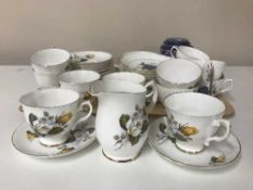 A tray containing a Royal Grafton and a Dorcester china tea service,