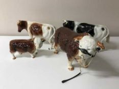 A tray containing four china bulls