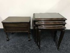 An oak stool and nest of three tables