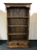 A set of hardwood open bookshelves fitted two drawers