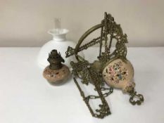 A late 19th century gilt metal hanging oil lamp with chimney and shade