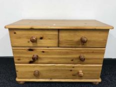 A pine four drawer chest