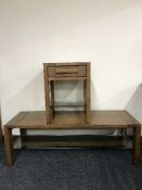 An oak coffee table and matching lamp table