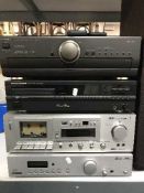 A Technics stereo integrated amplifier together with a Morantz CD player, both with remotes,